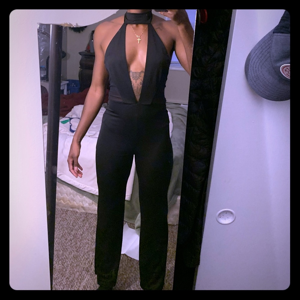 Super sexy, deep V, open back black jumpsuit!